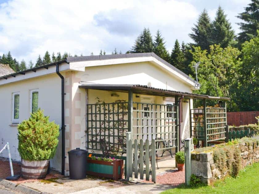 Entrance with shaded sitting out area | Fir Tree Cottage - Border Forest Cottages, Cottonshopeburnfoot, near Otterburn
