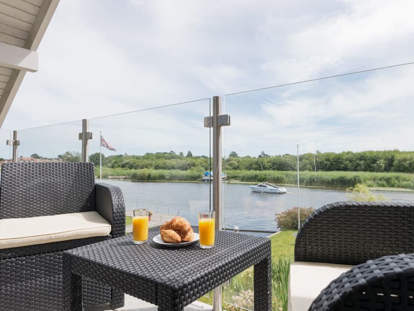 Outdoor furniture on master suite balcony | Silver Dawn, Horning, near Wroxham