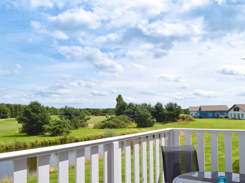 Balcony with lovely views of the golf course | Pine View, Fritton, near Great Yarmouth