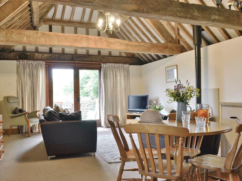 Open plan living/dining room/kitchen with beamed ceilings and character | The Carthouse, Lea, Malmesbury