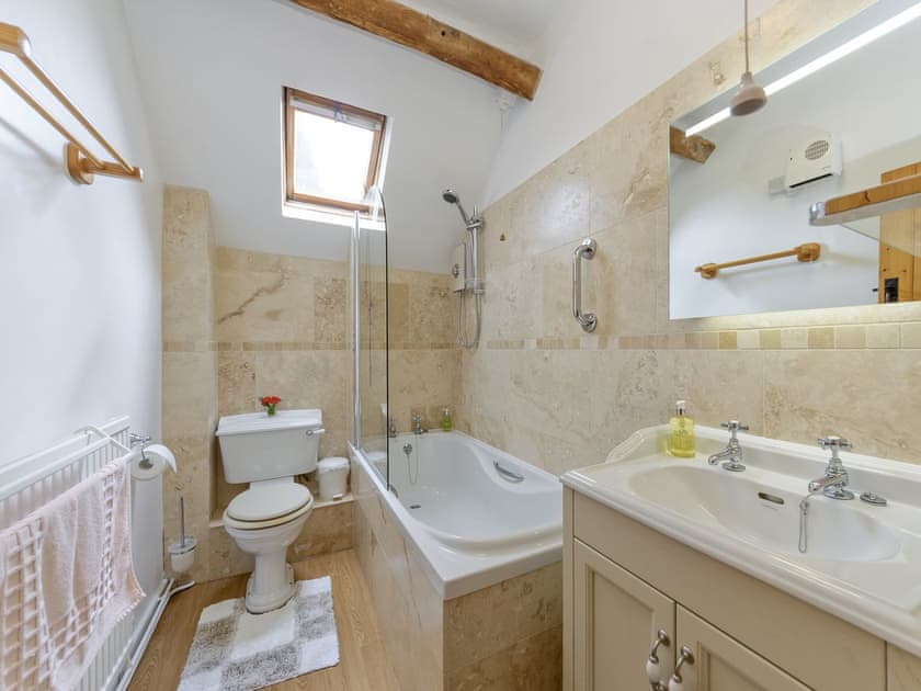 Family bathroom with shower over bath | The Mill House, Lea, near Ross-on-Wye