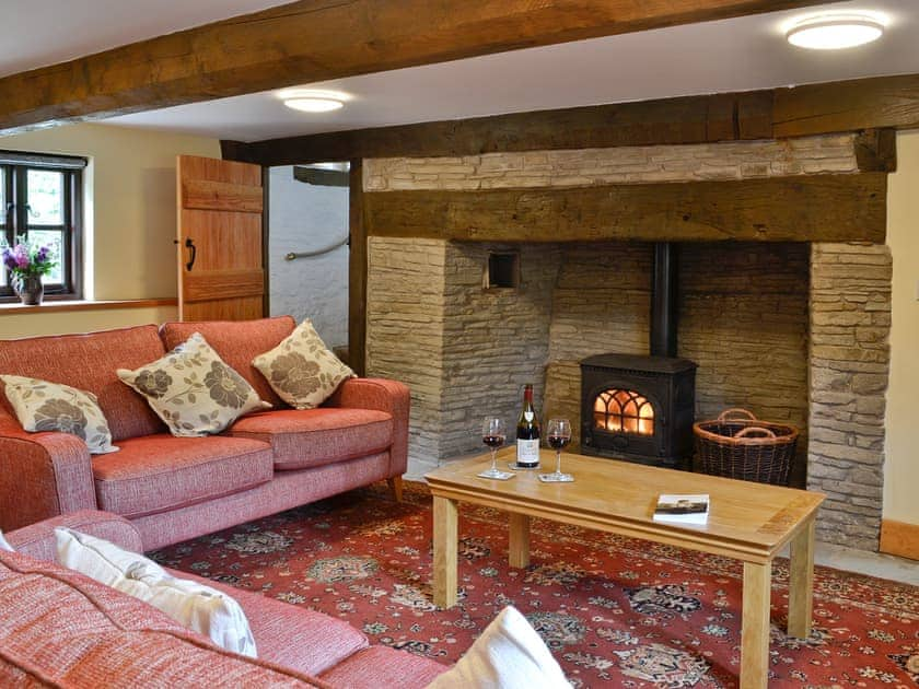 Living room with inglenook fireplace and wood burner | Mill Cottage, Peterchurch, near Hay-on-Wye