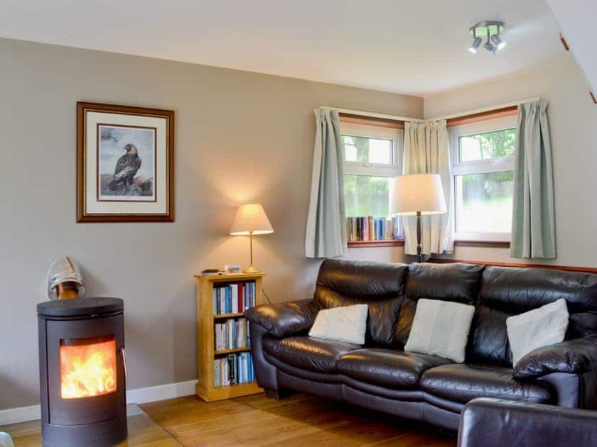 Cosy living area with wood burner | Larch Cottage - Stronchullin Holiday Cottages, Blairmore, near Dunoon