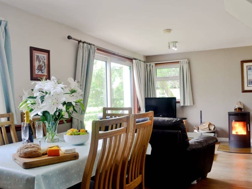 Well prsented, open living/ dining room leading to kitchen | Larch Cottage - Stronchullin Holiday Cottages, Blairmore, near Dunoon