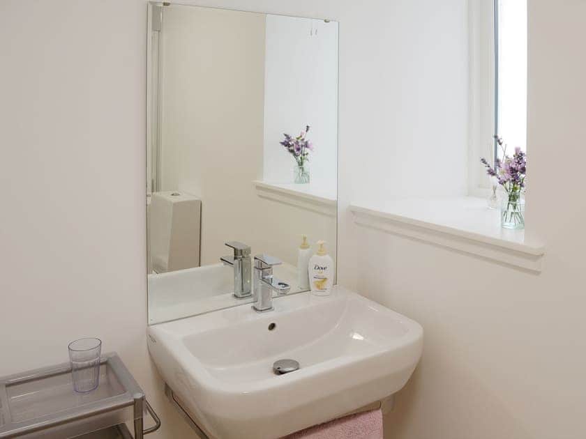 The shower room has a heated towel rail and a washbasin | Foundry Bank, Bonar Bridge