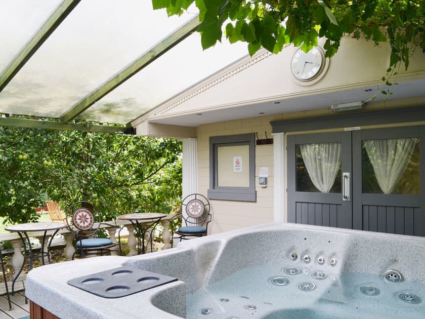 Relax in the private hot tub | Sedge Lodge - Wood Fen Lodges, Little Downham, near Ely