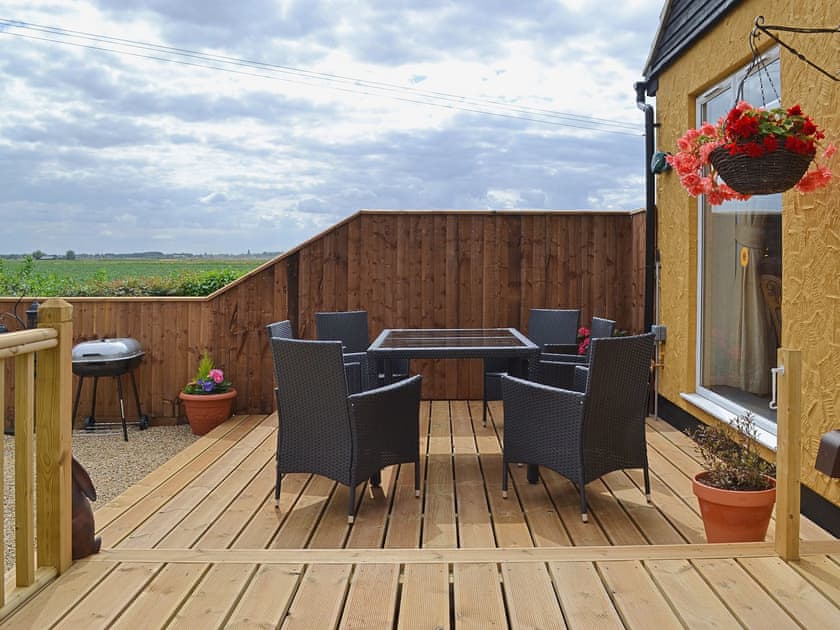 Lovely seating area where an outdoor meal can be enjoyed | Sedge Lodge - Wood Fen Lodges, Little Downham, near Ely