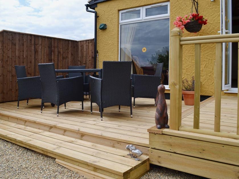 The raised decking are makes a great place for entertaining | Sedge Lodge - Wood Fen Lodges, Little Downham, near Ely