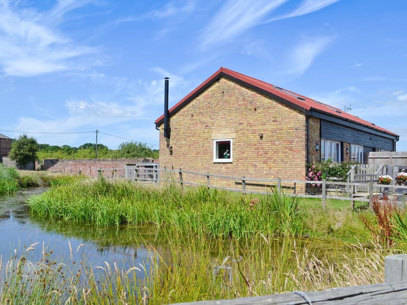 Charming semi detached properties located next to a pond | Romney Cottages, Peasmarsh, nr. Rye