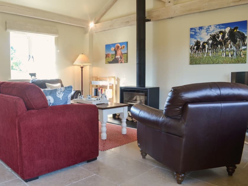 Lounge area with wood burner | The Old Cowshed, Hornblotton, near Glastonbury