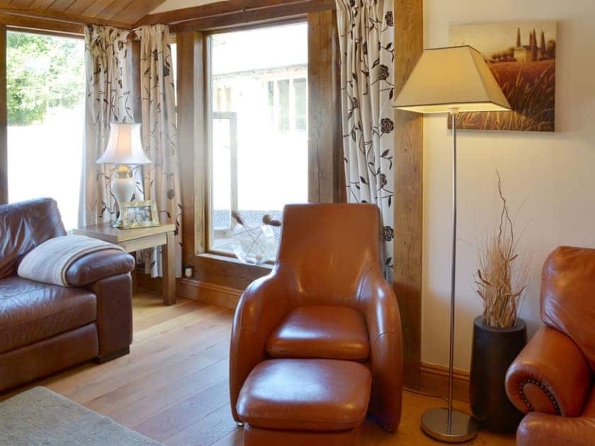 Large picture windows make the living room light and airy | Beer Farm, Waterrow, near Wiveliscombe