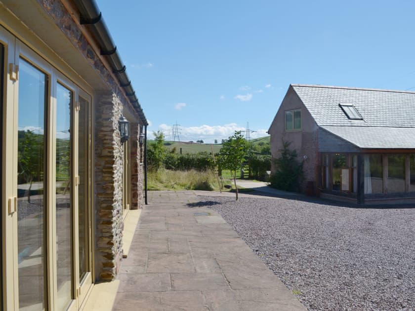 The swimming pool and house are close by each other | Beer Farm, Waterrow, near Wiveliscombe