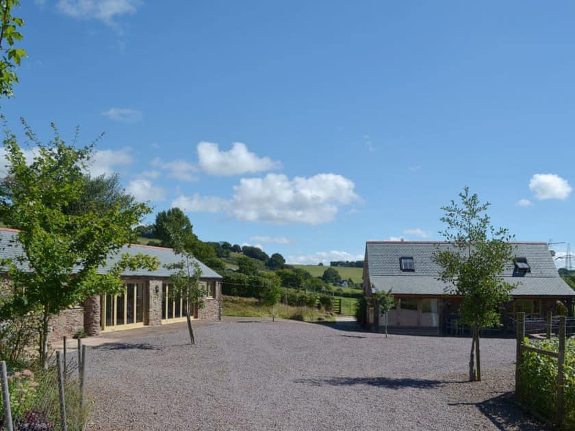 There is a large gravelled area in front of the property at the end of a secluded private lane | Beer Farm, Waterrow, near Wiveliscombe