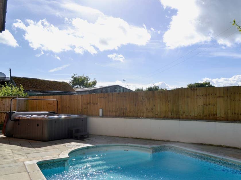 Luxurious hot tub on patio at poolside | Celyn, Montgomery
