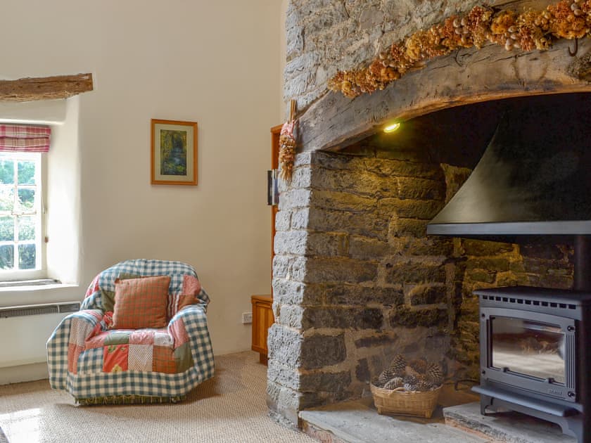 Rustic style living room with large inglenook fireplace | The Bothy, Clun, near Craven Arms