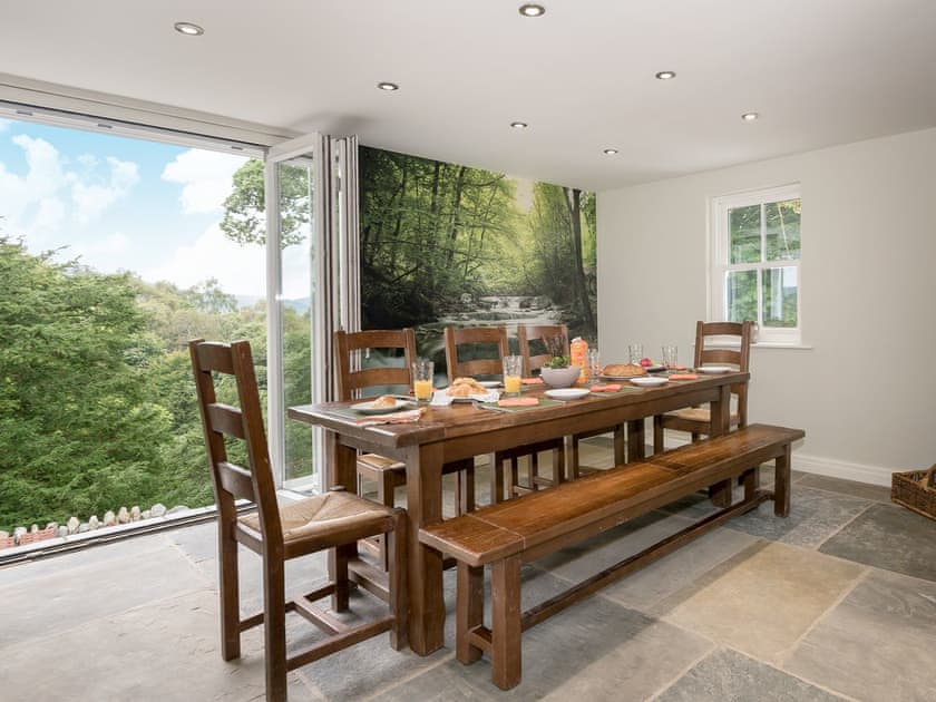 Wonderful dining area with views of the surrounding area | Waterfall Wood Cottage, Glenridding, by Ullswater