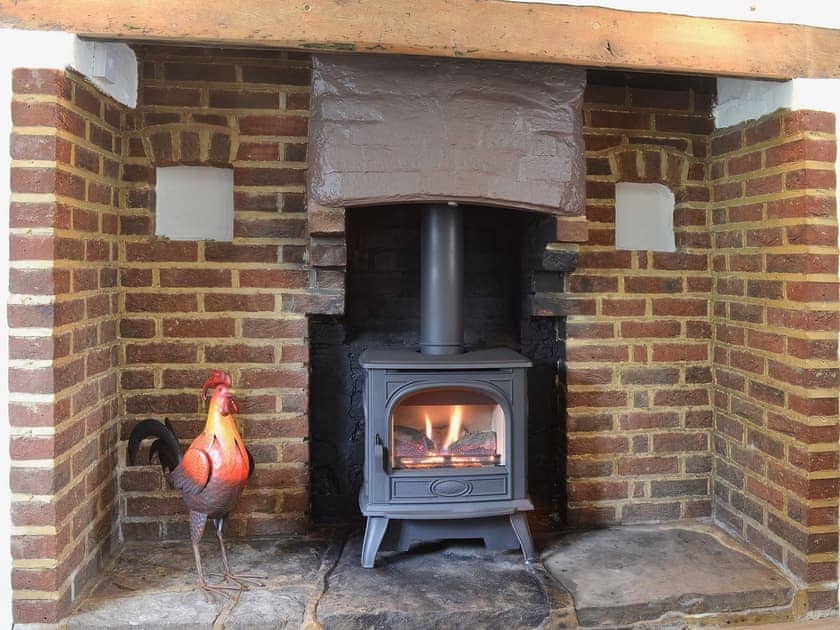 Feature inglenook fireplace | Little Birketts Cottage, Holmbury St Mary, near Dorking