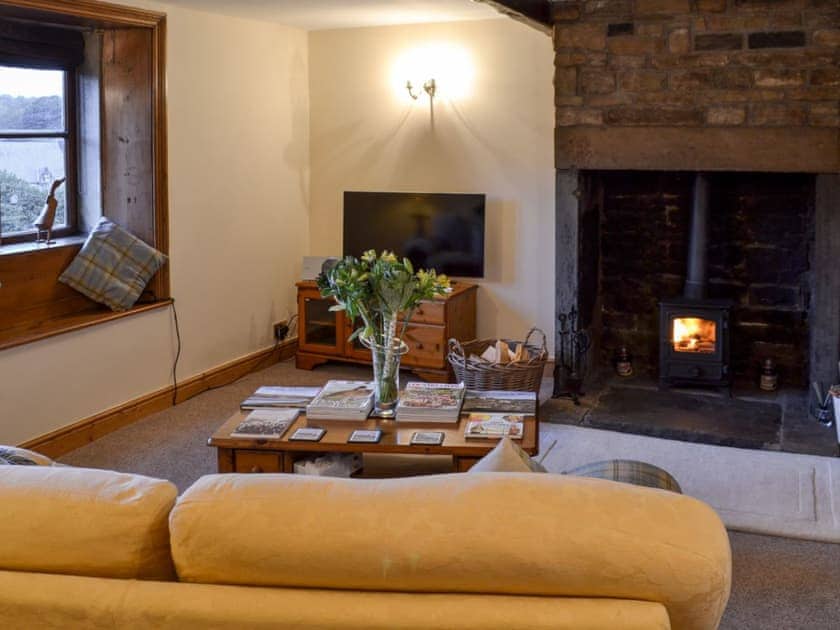 Living room with wood burner | Eider Cottage , Holmfirth