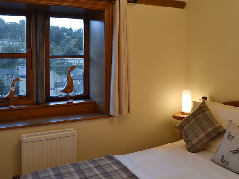 Double bedroom with mullioned | Eider Cottage, Holmfirth