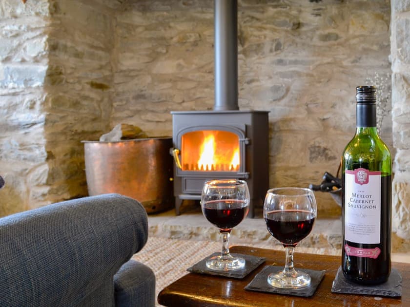 Warm and welcoming living area with wood burner | Bryn Gwnog, Llanrwst, near Betws-y-Coed