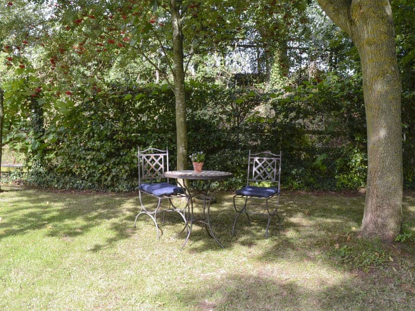 Sitting out area within garden | The Old Winery Cottage, Newent