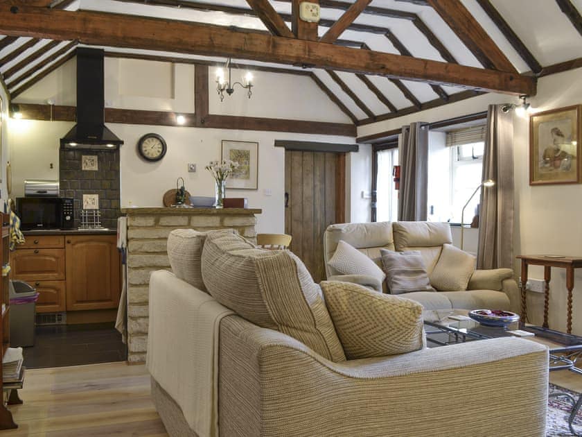Well-equipped kitchen within open-plan living space | Bakery Cottage, Ampney Crucis, near Cirencester