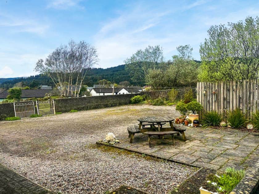 Enclosed rear courtyard and parking overlooking Deer Hill and forestry walks | Bayview, Carradale