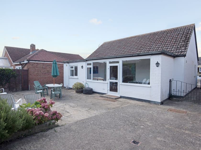 Sunny sitting out area to the rear of the property | The Swift, East Wittering