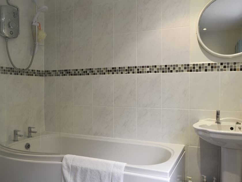 Bathroom with shower over bath | Ivy Cottage, Aldwark, near Matlock