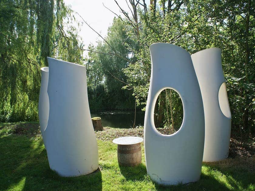 Contemporary seating in which to contemplate the passing river | The Writing Room, Barford, near Stratford-upon-Avon