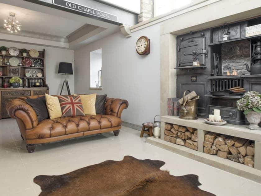 Lounge area benefits from double height ceiling and large upper level windows | Old Chapel House, Barnoldswick