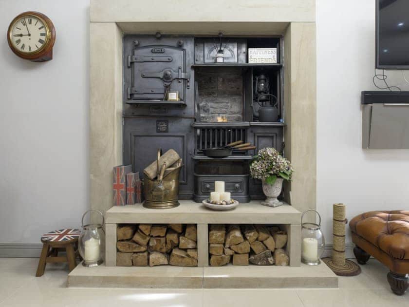 Characterful feature fireplace in lounge area | Old Chapel House, Barnoldswick