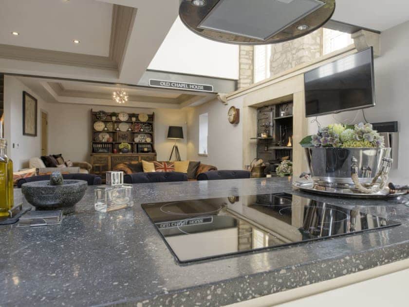 Looking over the kitchen island to the open plan living spaces | Old Chapel House, Barnoldswick