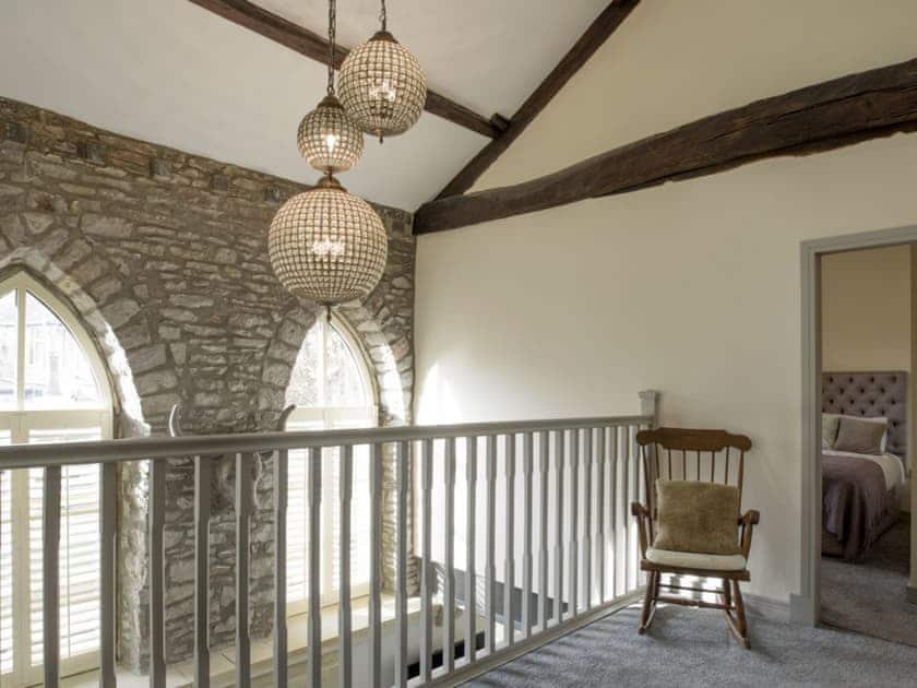 First floor landing with high ceiling revealing exposed wood beams | Old Chapel House, Barnoldswick