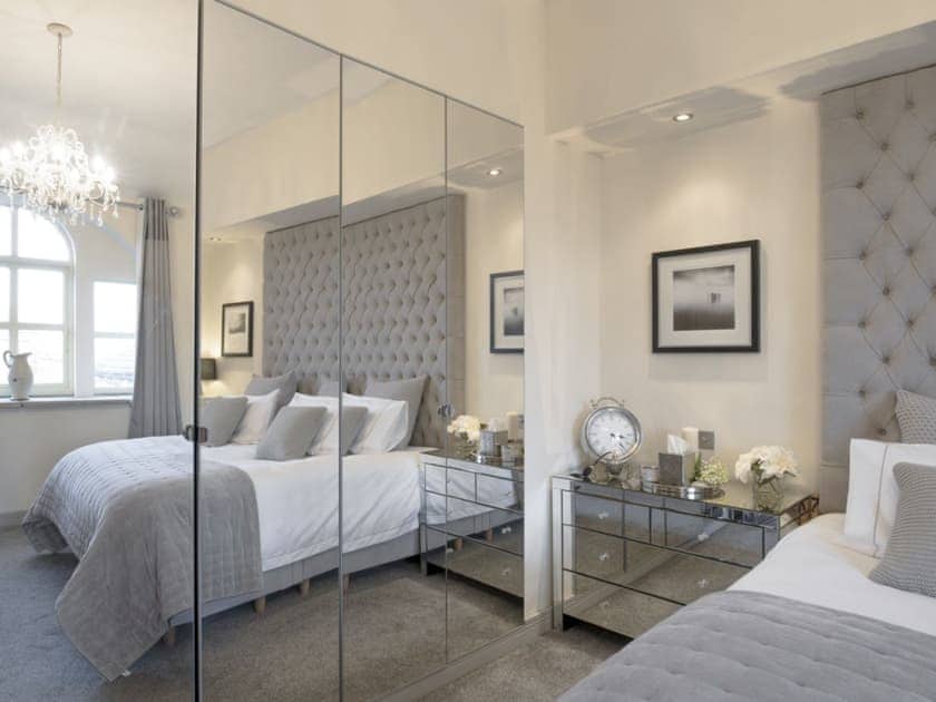 Mirrored storage within master bedroom | Old Chapel House, Barnoldswick