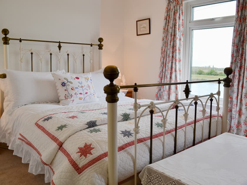 Comfortable double bedroom with riverside views | Greenbank Cottage, Ten Mile Bank, near Downham Market