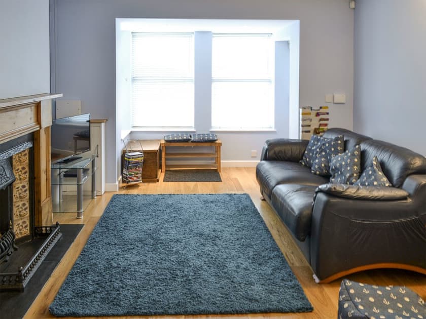 Living room with feature fireplace | Little Seahorse - Seahorses, Sheringham