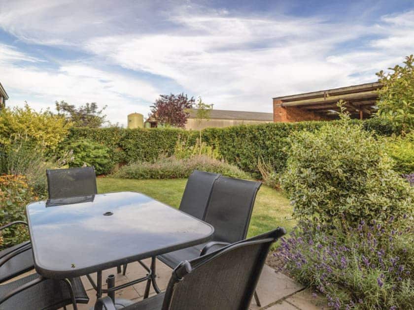 Outdoor furniture within garden | The Hayloft - Mackinder Farms, Brayton, Selby