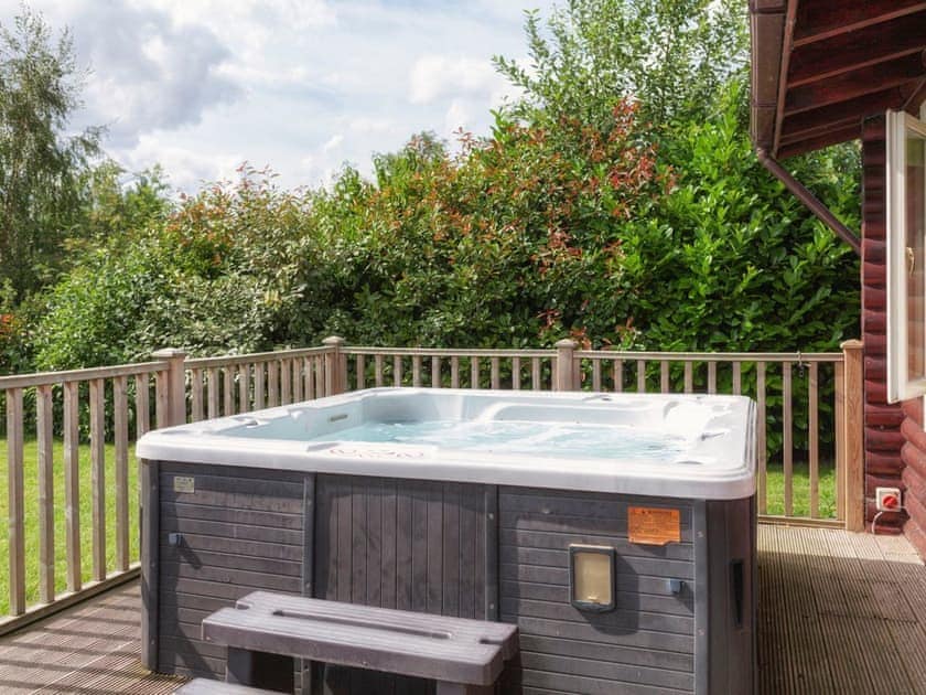 Luxurious hot tub on enclosed decked patio | Partridge Lodge - Mackinder Farms, Brayton, Selby
