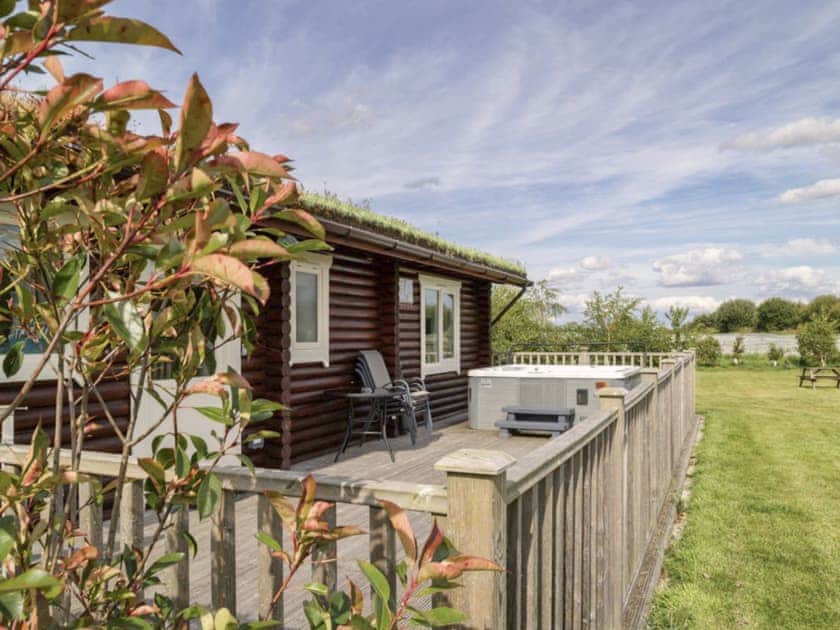 Enclosed decked terrace to front of holiday home | Kingfisher Lodge - Mackinder Farms, Brayton, Selby