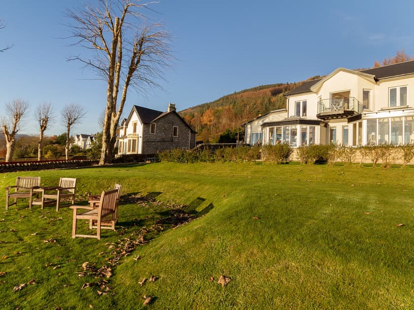 Landscaped garden reaching right to Loch Long’s edge | The Penthouse, Strone, near Dunoon