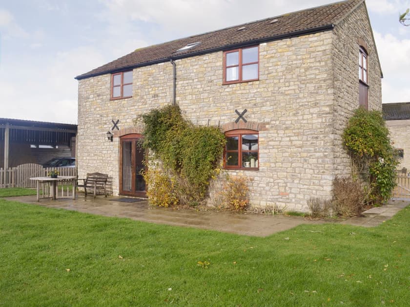 Stone built holiday home with paved patio  | The Creamery, North Wootton, near Wells