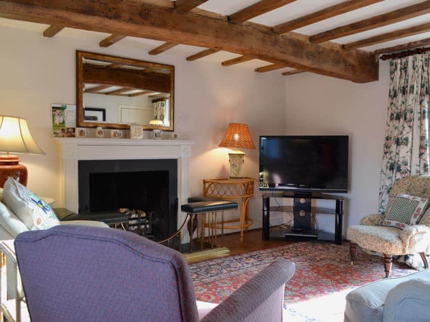 Cosy living room with open fire | Mill House - Rievaulx Cottages, Rievaulx, near Helmsley