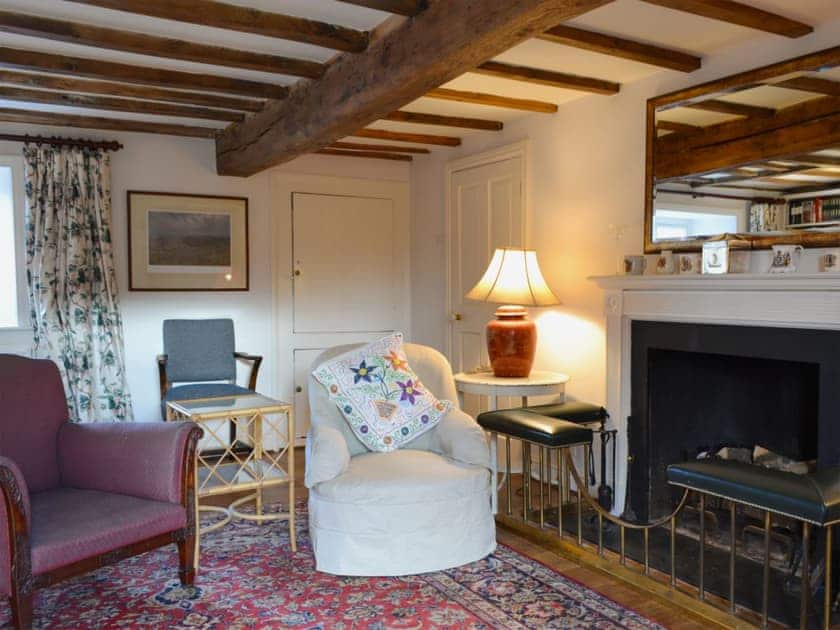 Cosy living room with open fire | Mill House - Rievaulx Cottages, Rievaulx, near Helmsley