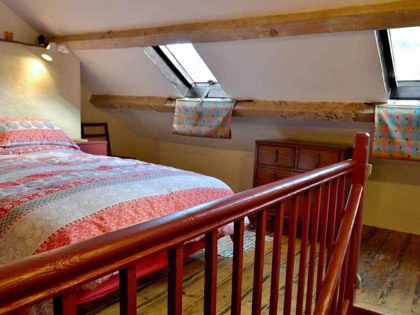 Double bedroom with beamed sloping ceiling | Bryn Rhos Goch, Cwm Penmachno, near Betws-y-Coed