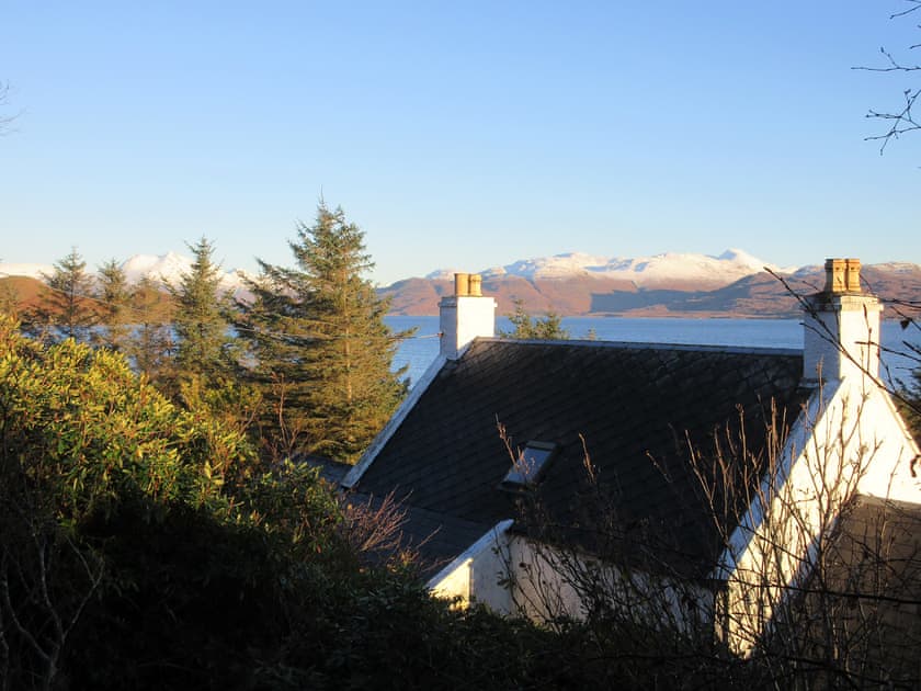 The property nestles close to the shore | South Bay Cottage, Saasaig, Teangue, Isle of Skye