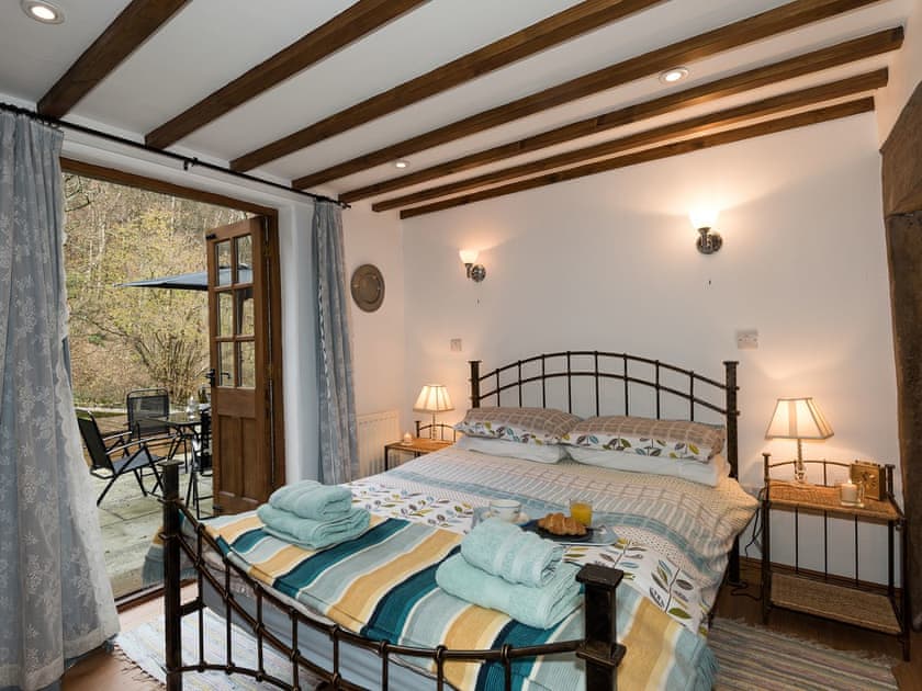 Ground floor double bedroom with patio doors | The Old Bothy, Watermillock, near Ullswater