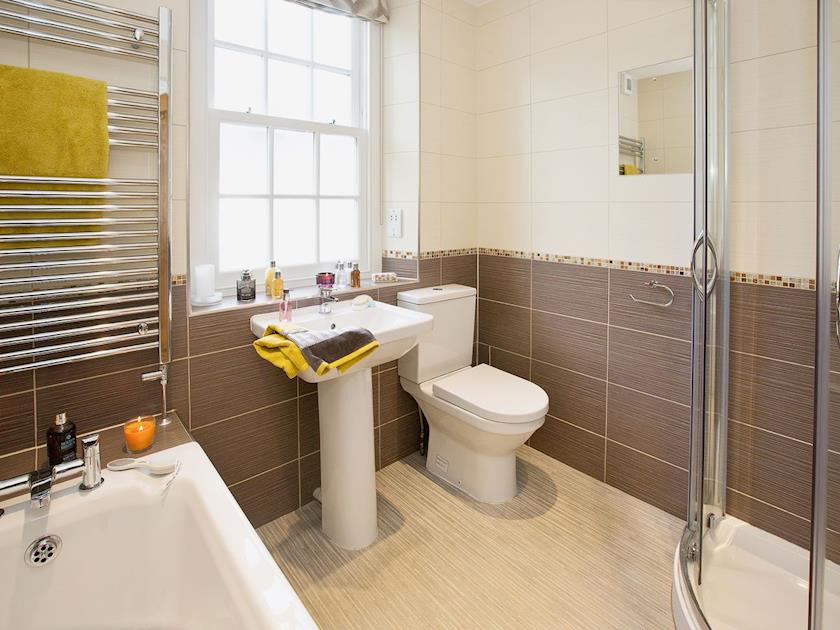 Spacious tiled bathroom with stand-alone shower | 22 Rose Terrace, Keswick