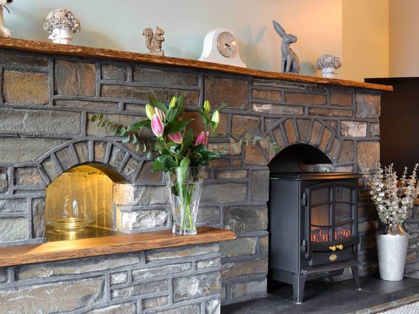 Stone fireplace | Dyffryn Haidd - Afan Holiday Cottages, llanafan/Aberystwyth