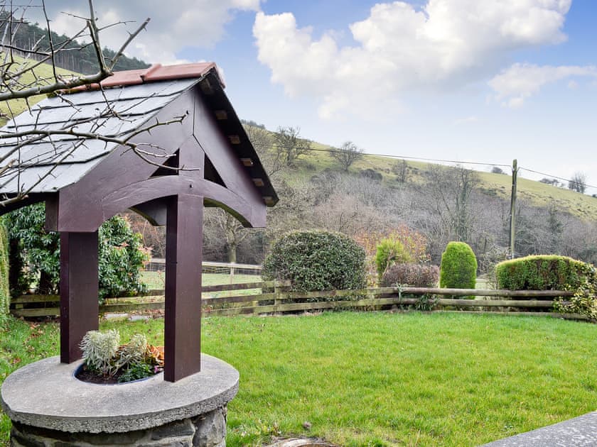 Garden and view | Dyffryn Haidd - Afan Holiday Cottages, llanafan/Aberystwyth